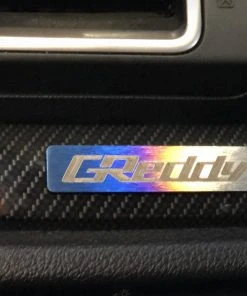 Titanium GReddy Emblem - (70x15mm)